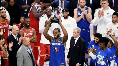Kawhi Leonard of Team LeBron celebrates with the trophy after being named the Kobe Bryant MVP. AFP