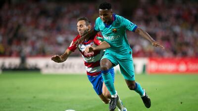 Granada's Spanish defender Victor Diaz vies with Barcelona's Guinea-Bissau forward Ansu Fati. AFP
