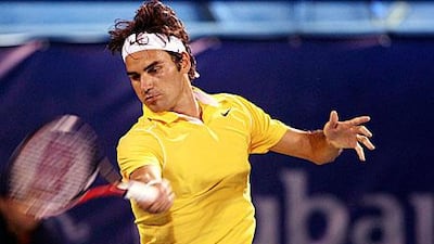 Roger Federer returns the ball to Sergiy Stakhovsky during their Dubai Duty Free Tennis Championships yesterday.