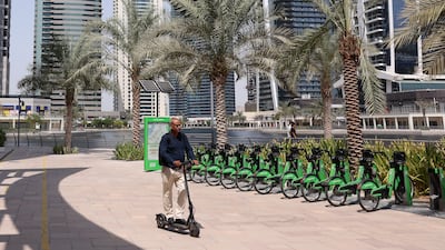 Dubai's Roads and Transport Authority has announced greater connectivity between communities for e-scooter riders and cyclists, reminding riders of their responsibility for safety. Chris Whiteoak / The National