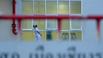 A nurse walks in front of the hospital where four of the boys rescued on Sunday are being treated. AFP