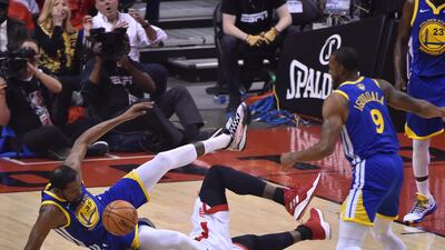 Golden State Warriors forward Kevin Durant, left, and Toronto Raptors centre Serge Ibaka collide during the first half of the NBA Finals Game 5 at Scotiabank Arena in Toronto, Canada. EPA