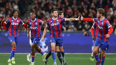 Palace defender Joel Ward, centre, is congratulated by teammates after scoring. AP