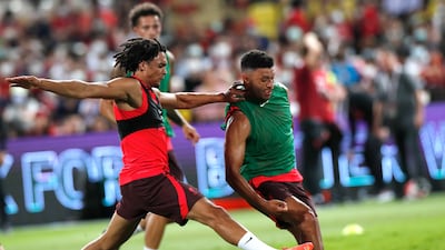 Liverpool players Trent Alexander-Arnold and Alex Oxlade-Chamberlain perform during training in Bangkok. EPA