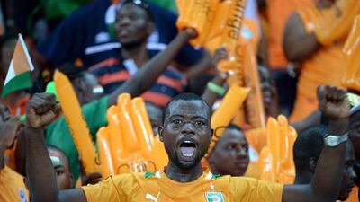 An Ivorian fan cheers for his team during the 2015 African Cup of Nations semi-final football match between Democratic Republic of the Congo and Ivory Coast in Bata on February 4, 2015. AFP PHOTO / KHALED DESOUKI