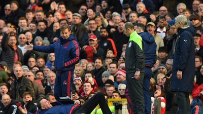 Louis van Gaal, Manager of Manchester United makes a point to the fourth official with Arsene Wenger, Manager of Arsenal during the Barclays Premier League match between Manchester United and Arsenal at Old Trafford on February 28, 2016 in Manchester, England. (Photo by Shaun Botterill/Getty Images)