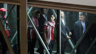 Ahmed Abughaush, centre. Khalil Mazraawi / AFP