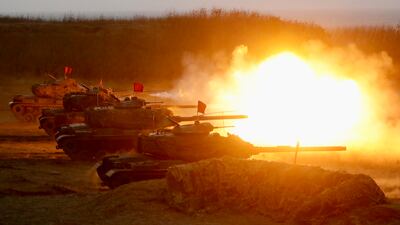 Taiwanese tanks fire at targets during a live-fire exercise in Penghu, Taiwan. EPA