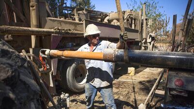 Drill helper Jimmy Payne rigs another 20-foot section of pipe as they work to deepen the Brady family well. Max Whittaker / Reuters