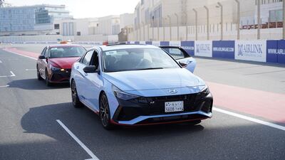 The cars re-enter the pit lane.