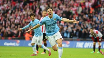 Samir Nasri and Manchester City need four points from their final two matches to seal up the Premier League title. Jamie McDonald / Getty Images