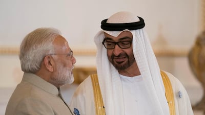 ABU DHABI, UNITED ARAB EMIRATES - February 10, 2018: HH Sheikh Mohamed bin Zayed Al Nahyan Crown Prince of Abu Dhabi Deputy Supreme Commander of the UAE Armed Forces (R), receives HE Narendra Modi Prime Minister of India (L), at the Presidential Airport. ( Omar Al Askaar for the Crown Prince Court) ---