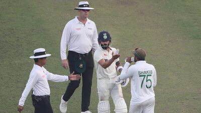 India's Virat Kohli complains to Shakib Al Hasan after his dismissal. AP