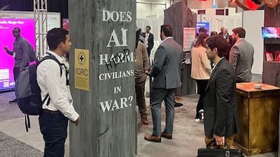 The Red Cross booth at the AI+ convention in Washington, surrounded by the stalls of defence contractors and technology giants. Photo: Cody Combs