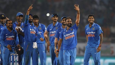 India's Amit Mishra, second right, gestures towards the pavilion as he celebrates with teammates after taking the fifth wicket. Aijaz Rahi / AP Photo / October 29, 2016