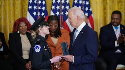 Mr Biden awards the Presidential Citizens Medal to US Capitol Police Officer Caroline Edwards. AFP