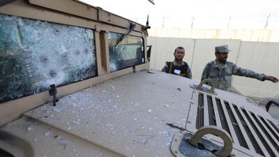 Afghan security officials inspect the armoured vehicles used by militants during an attack outside the Interior Ministry building, in Kabul, Afghanistan, 30 May 2018. EPA/JAWAD JALALI