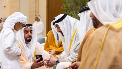 President Sheikh Mohamed speaks with Sheikh Saif bin Zayed, Deputy Prime Minister and Minister of Interior, at the event.