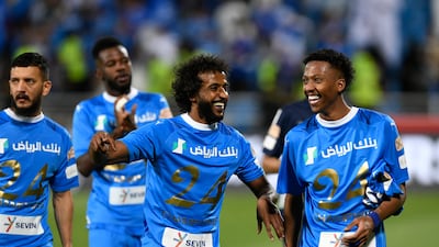 Al Hilal's Yasser Al-Shahrani celebrates with teammates . Reuters