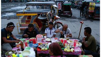 Filipino tricycle drivers having iftar during Ramadan in Taguig, Metro Manila, the Philippines on June 12, 2016. Photo by Erik De Castro