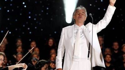 Italian tenor Andrea Bocelli waves to the crowd during his performance with the New York Philharmonic Orchestra at Central Park's Great Lawn in New York September 15, 2011. REUTERS/Shannon Stapleton (UNITED STATES - Tags: ENTERTAINMENT) - RTR2RDGA