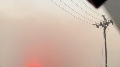 Smoke rises from a burning mountainside in Cape Town. Twitter /@Aleygilmore / via Reuters