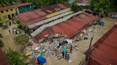 A collapsed residential building in Bogo. Getty Images
