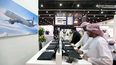 Visitors browse the Etihad Airways booth at the Tawdheef career fair in Abu Dhabi. Satish Kumar / The National