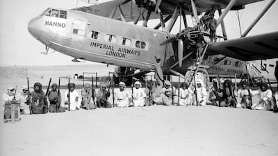 The Imperial Airways Hannibal Class Handley Page HP42 passenger plane Hanno, surrounded by an armed guard provided by the Sheikh of Sharjah during a refuelling stop at Kuwait. Photo by Fox Photos/Getty Images