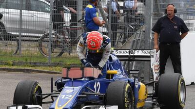 Felipe Nasr leaves his car after a technical defect during the German Grand Prix in July. Uli Deck / Pool Photo