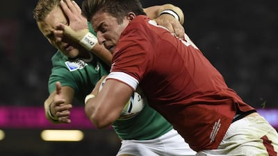 Canada's wing DTH van der Merwe, right blocks Ireland's fly half Ian Madigan to score a try. AFP