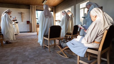 Nuns take part in a Good Friday mass at The Benedictine Monastery Notre-Dame de l'Alliance in Rixensart, some 20kms south-east of Brussels. AFP