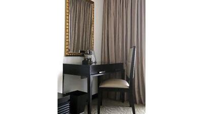 Gold leaf, which is introduced in the living area, is continued in the study area. Jeff Topping / The National