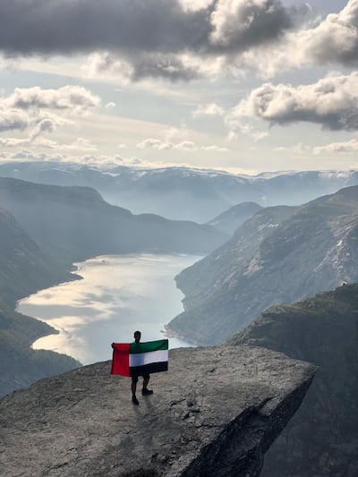 Three Emirati trekkers are spreading the word about the UAE, by flying the flag at the summit of Trolltunga, in Norway.