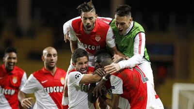 Fabinho of AS Monaco is mobbed by teammates after scoring against Zenit St Petersburg in their 2-0 Champions League victory to advance to the last 16 on Tuesday night. Sebastien Nogier / EPA / December 9, 2014