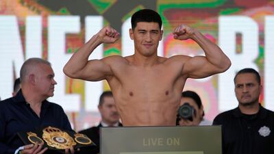 Dmitry Bivol on the scales during the weigh-in for his fight against Saul Alvarez. AP