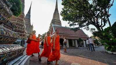 Buddhist monks walk in the Wat Pho temple in Bangkok, Thailand. The Thai capital, ranking second, is set to see a 6.9 per cent increase in international visitors in 2019. AFP