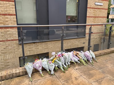 Floral tributes were left at the scene of the stabbing. PA
