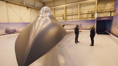 Boris Johnson stands next to a jet during a visit to BAE Systems. Team Tempest is a group of industry partners working together to develop future combat air concepts. AFP