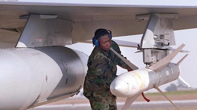 A US weapons technician secures an AGM-88 high-speed anti-radar missile at Incirlik Air Base in Turkey, after the jet returned from a mission over Iraq. AFP