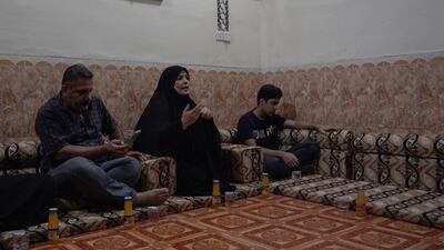 With her husband and brother while visiting potential voters on the campaign trail. Haider Husseini / The National