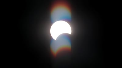 A partial solar eclipse is seen from the Cairo suburb of Maadi, Egypt, June 21, 2020. Reuters