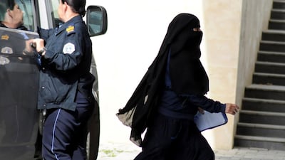 A woman repatriated to Kosovo from Syria enters the Basic Court in Pristina, Kosovo, April 23, 2019. Reuters