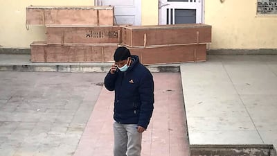 A government official outside a community health centre in Katra, near Jammu, where the bodies of those killed in the shrine stampede were being kept. AP