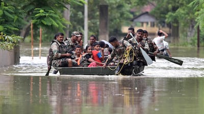The army pulls affected villagers to safety.