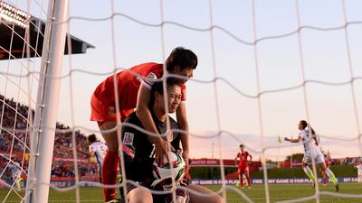 Lars Baron, Germany, Fifa Pictures: Fei Wang of China looks dejected after Carli Lloyd of USA scored the first goal in the Women’s World Cup quarter-final. This image was a finalist candidate in the photography category of the inaugural Sport Media Pearl Awards, which is managed by the International Sports Press Association (AIPS) and hosted by Abu Dhabi Media, publishers of The National.