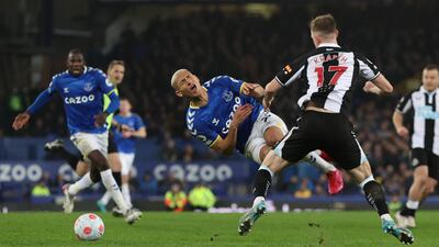 Everton's Richarlison goes down under the challege of Emil Krafth. Reuters