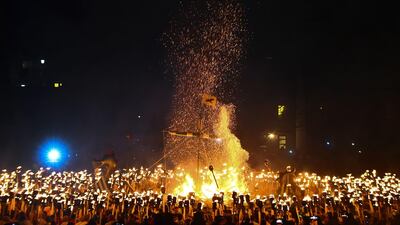Guizers dressed as Vikings set fire to a longship with burning brands as they take part in the Up Helly Aa festival in Lerwick, Shetland Islands. AFP