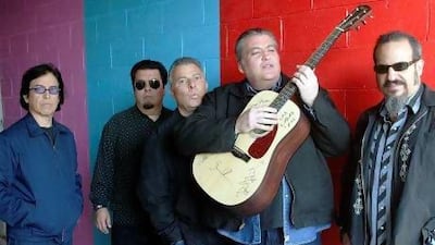 Los Lobos are, from left, Louie Perez, Cesar Rosas, Conrad Lozano, David Hidalgo and Steve Berlin. Damian Dovarganes / AP Photo