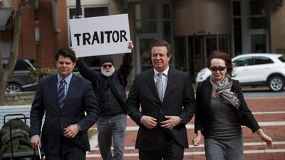 Former Trump Campaign Manager Paul Manafort (C), with his wife Kathleen Manafort (R), arrives for arraignment at the Federal Courthouse in Virginia. EPA